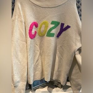 Target Sweater with Cozy written on it.